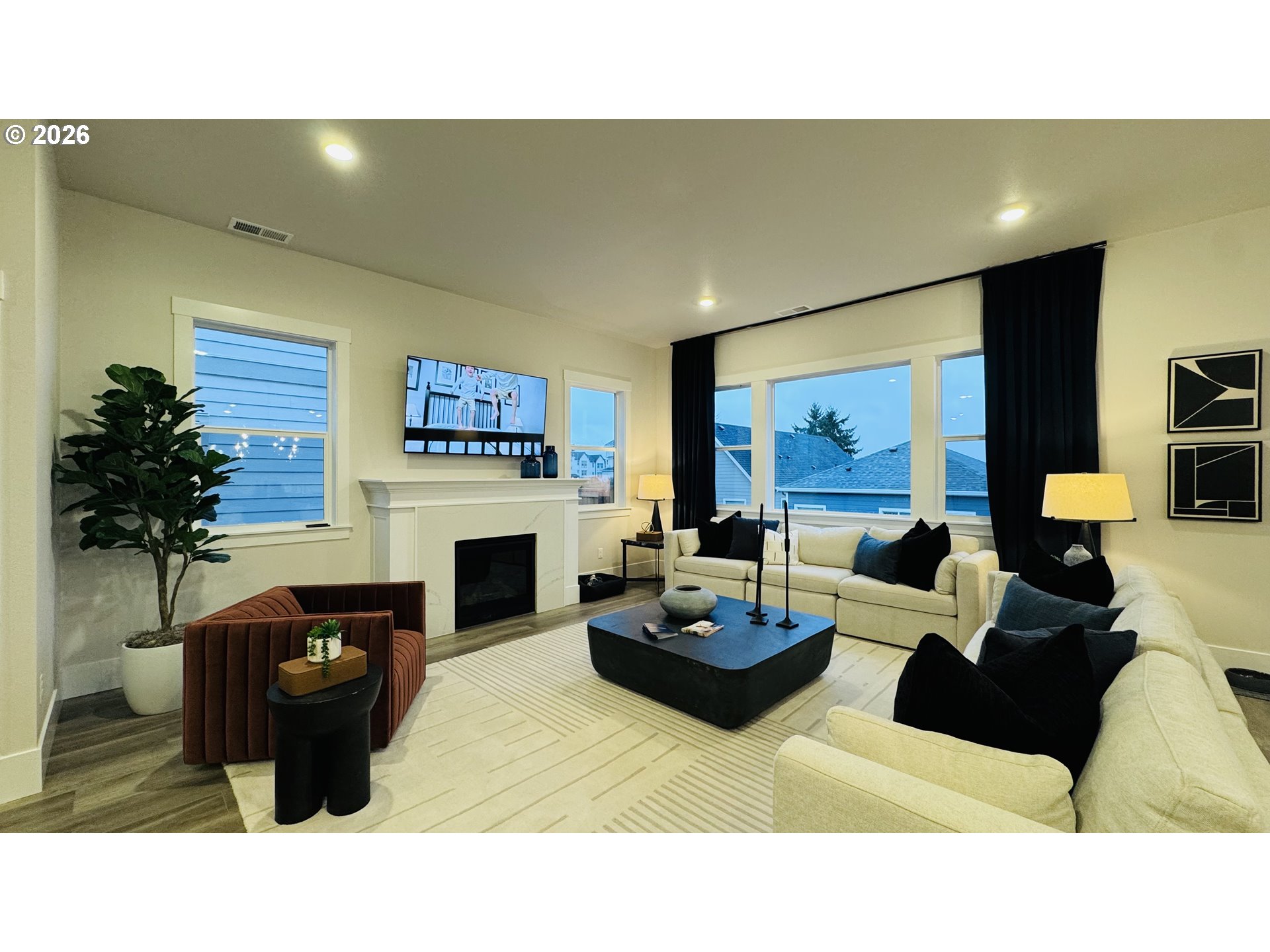 11651 Southwest Hayrick Terrace Beaverton, OR 97007 - Photo 9 of 44 a living room with furniture a fireplace and a potted plant