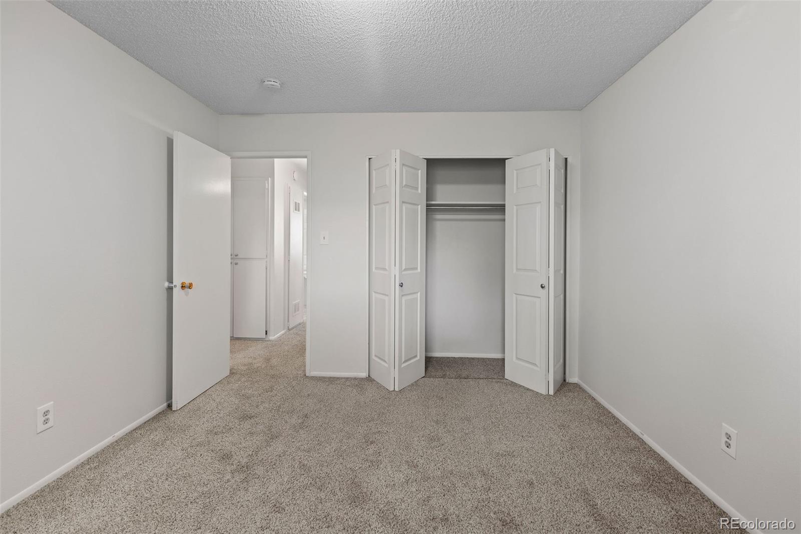 9149 Mansfield Avenue, Unit L Denver, CO 80237 - Photo 23 of 35 a view of an empty room