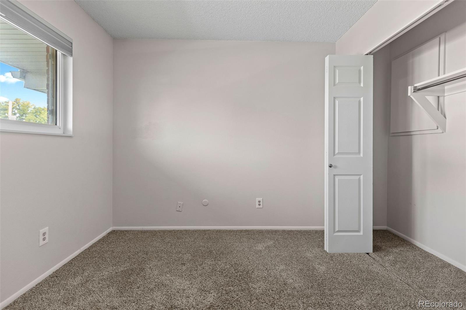 9149 Mansfield Avenue, Unit L Denver, CO 80237 - Photo 27 of 35 a view of an empty room
