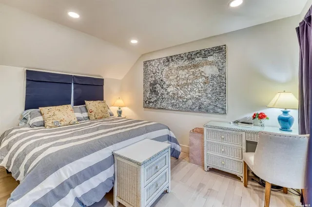 a bedroom with a bed and a desk