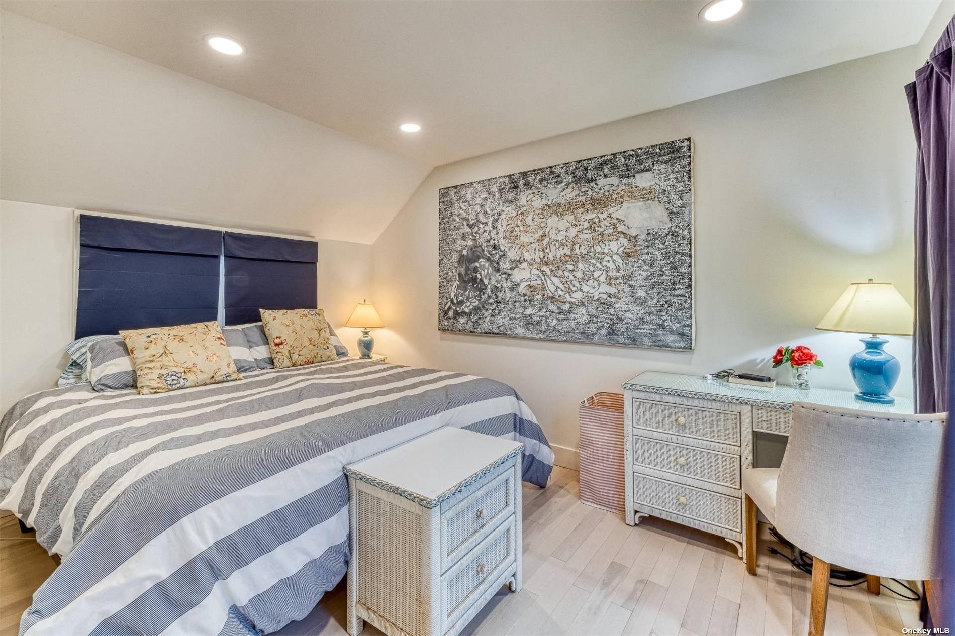 2430 Dignans Road Cutchogue, NY 11935 - Photo 16 of 26 a bedroom with a bed and a desk