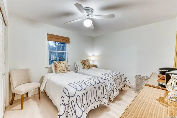 a bedroom with a bed and a table