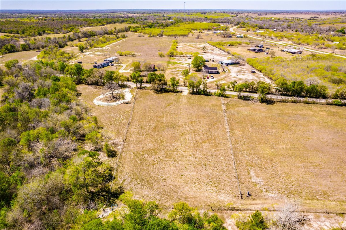 169 Sand Hill Road Dale, TX 78616 - Photo 12 of 15 an aerial view of residential houses with outdoor space