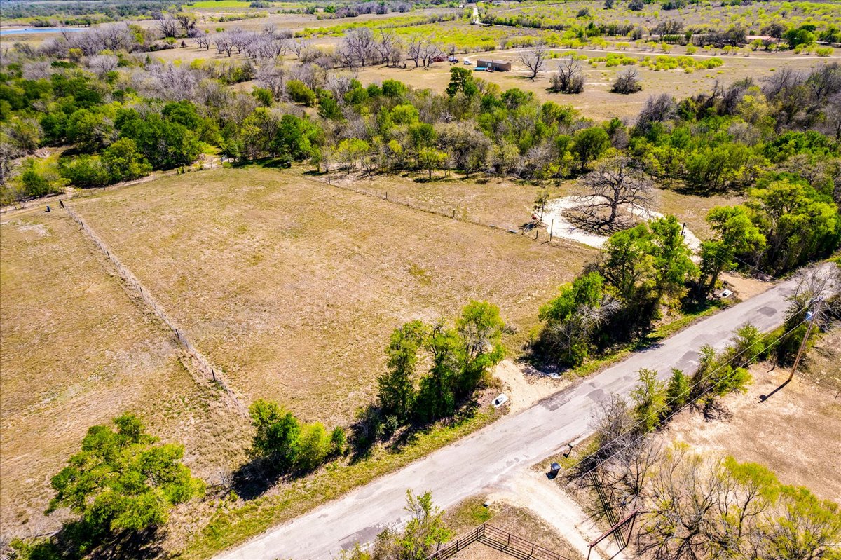 169 Sand Hill Road Dale, TX 78616 - Photo 7 of 15 a view of a yard with flower plants
