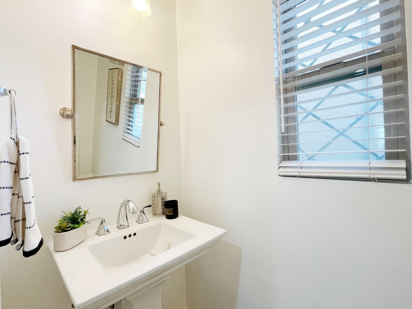 1325 Dahlia Loop San Jose, CA 95126 - Photo 11 of 31 a bathroom with a sink and a mirror