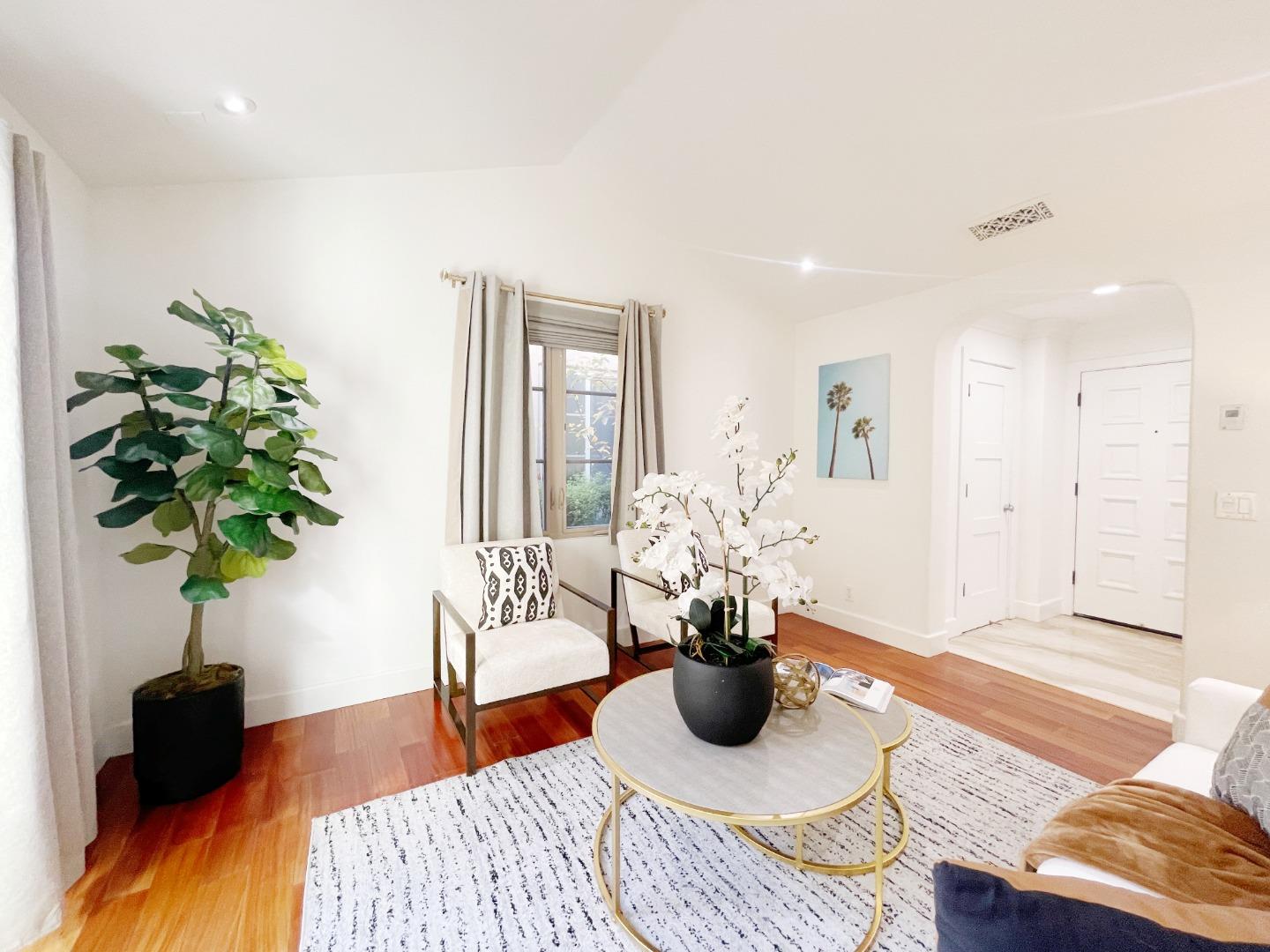 1325 Dahlia Loop San Jose, CA 95126 - Photo 3 of 31 a living room with furniture potted plant and wooden floor