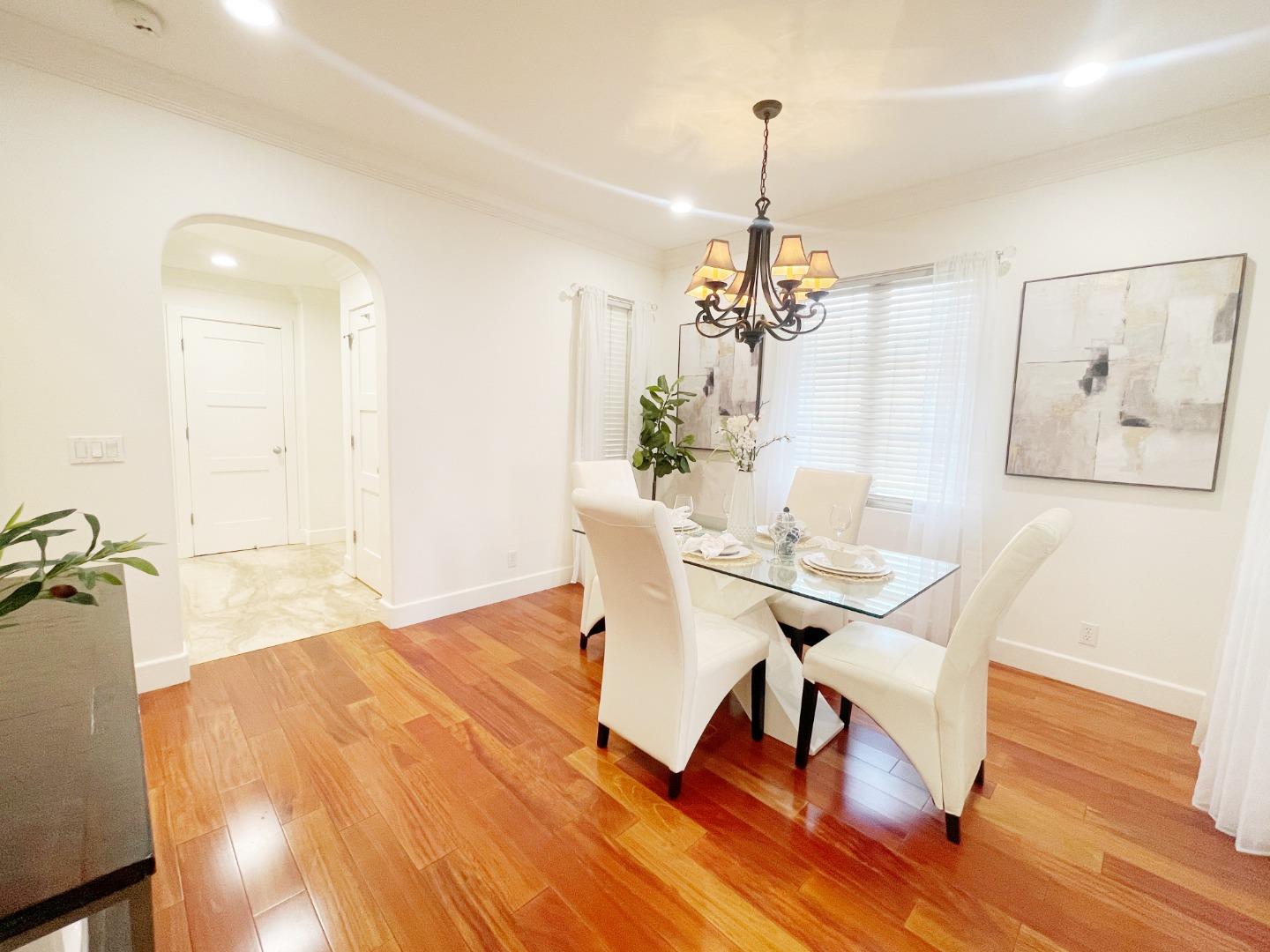 1325 Dahlia Loop San Jose, CA 95126 - Photo 6 of 31 a view of a dining room with furniture and wooden floor