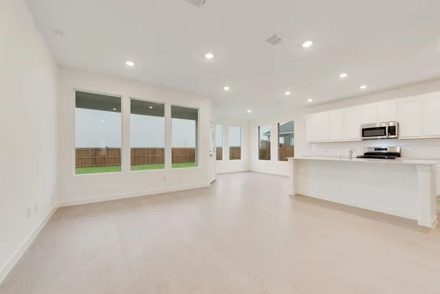 a bathroom with double sink and a mirror