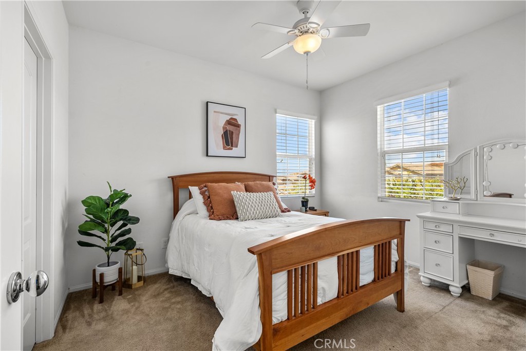28640 Farrier Drive Valencia, CA 91354 - Photo 26 of 67 a bedroom with a bed table and a window