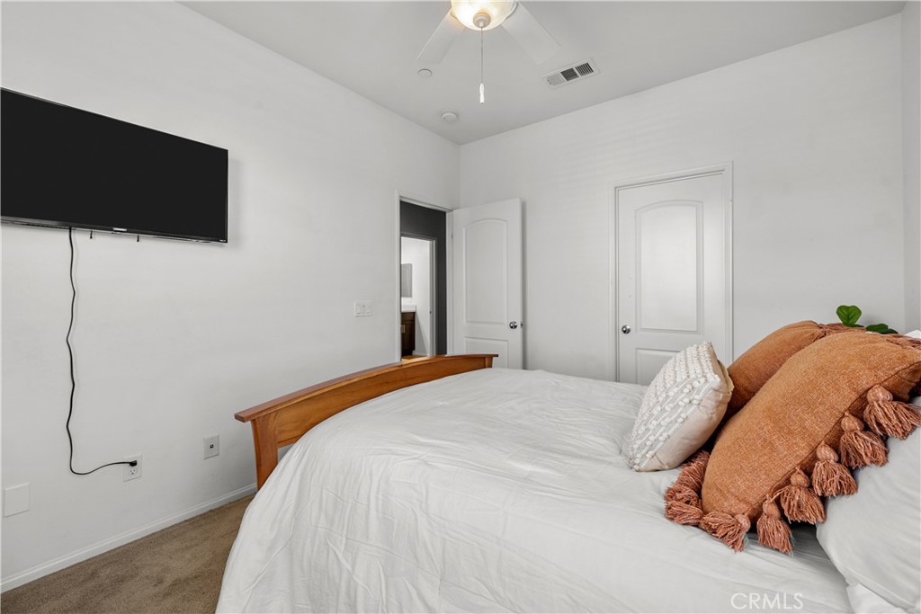 28640 Farrier Drive Valencia, CA 91354 - Photo 27 of 67 a bedroom with a bed and a flat screen tv