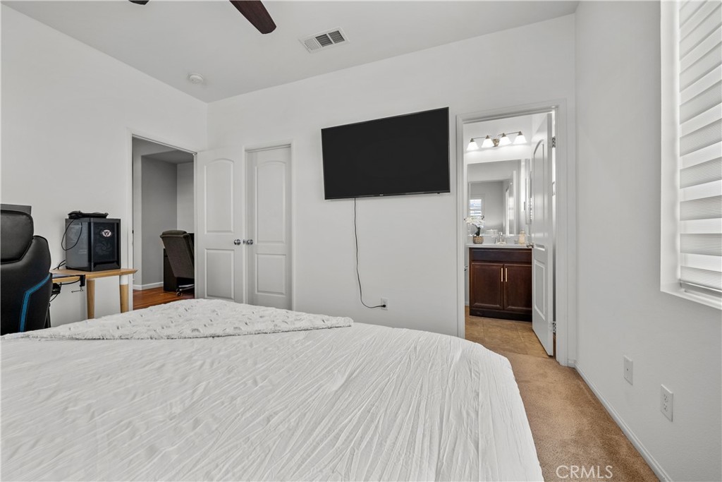 28640 Farrier Drive Valencia, CA 91354 - Photo 30 of 67 a bedroom with a bed and a flat screen tv