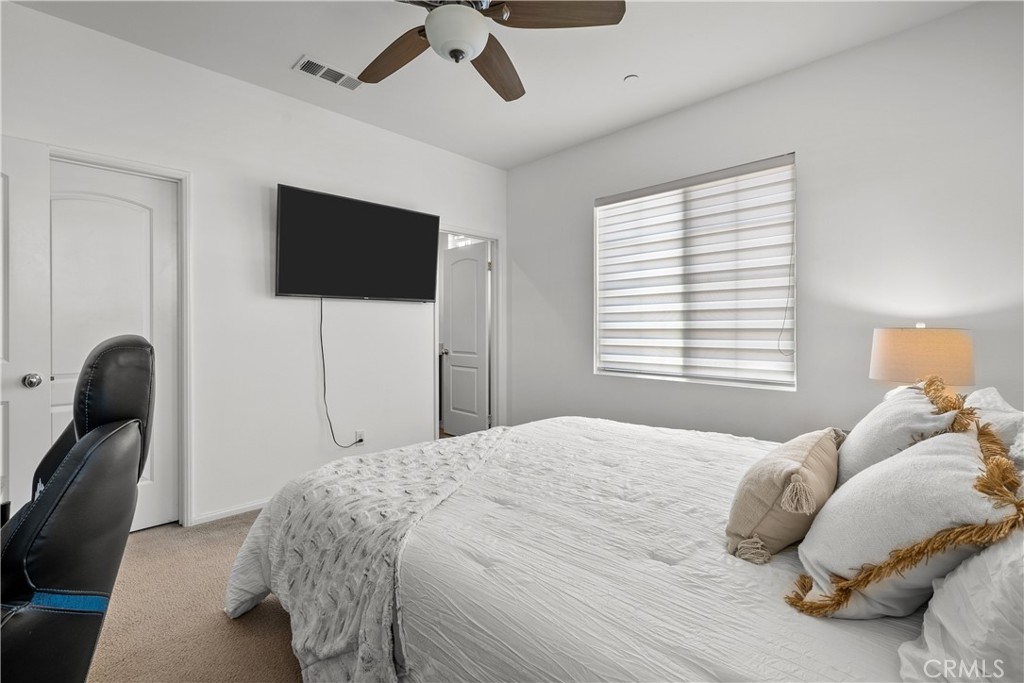 28640 Farrier Drive Valencia, CA 91354 - Photo 31 of 67 a bedroom with a bed and flat screen tv