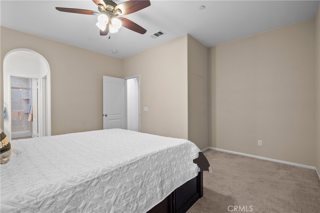 28640 Farrier Drive Valencia, CA 91354 - Photo 44 of 67 a bedroom with a bed and a chandelier