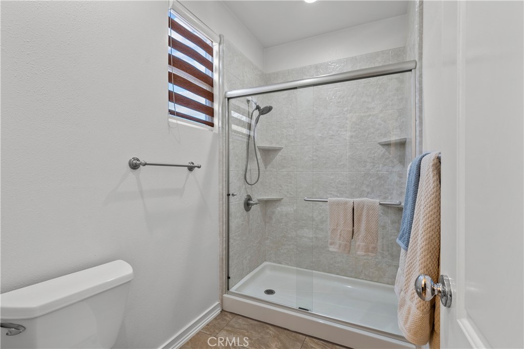 28640 Farrier Drive Valencia, CA 91354 - Photo 47 of 67 a bathroom with a shower and toilet