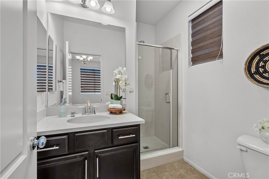 28640 Farrier Drive Valencia, CA 91354 - Photo 56 of 67 a bathroom with a sink and a mirror