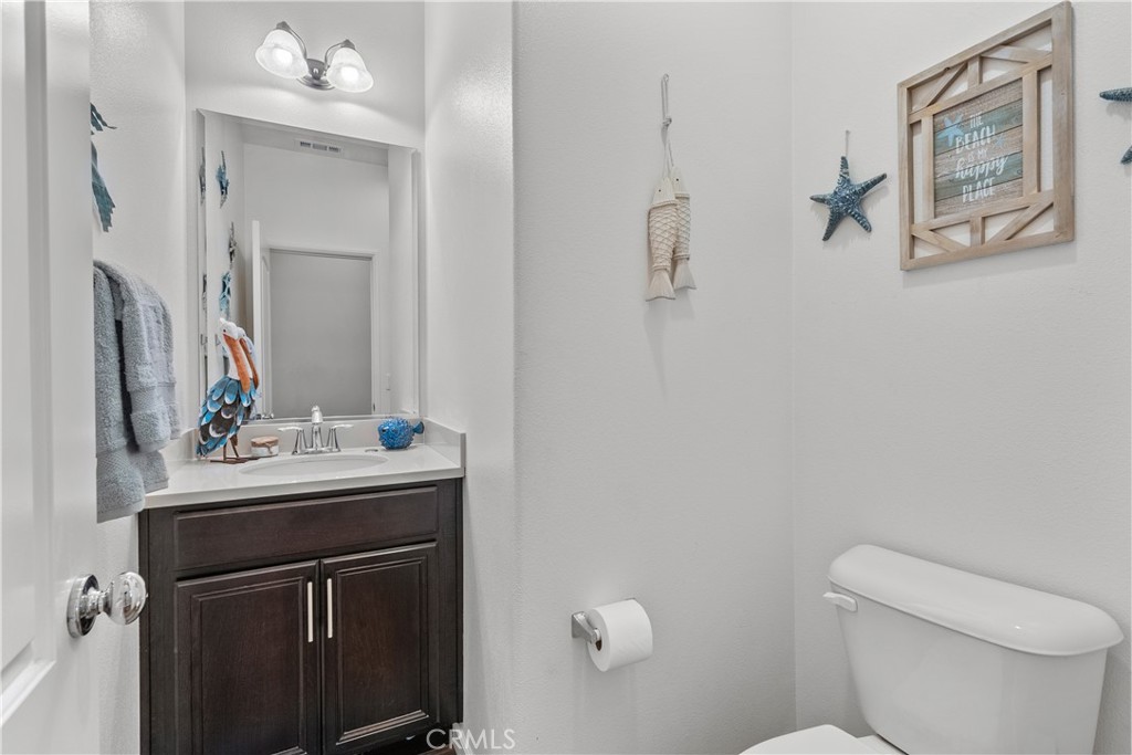 28640 Farrier Drive Valencia, CA 91354 - Photo 57 of 67 a bathroom with a toilet sink and mirror