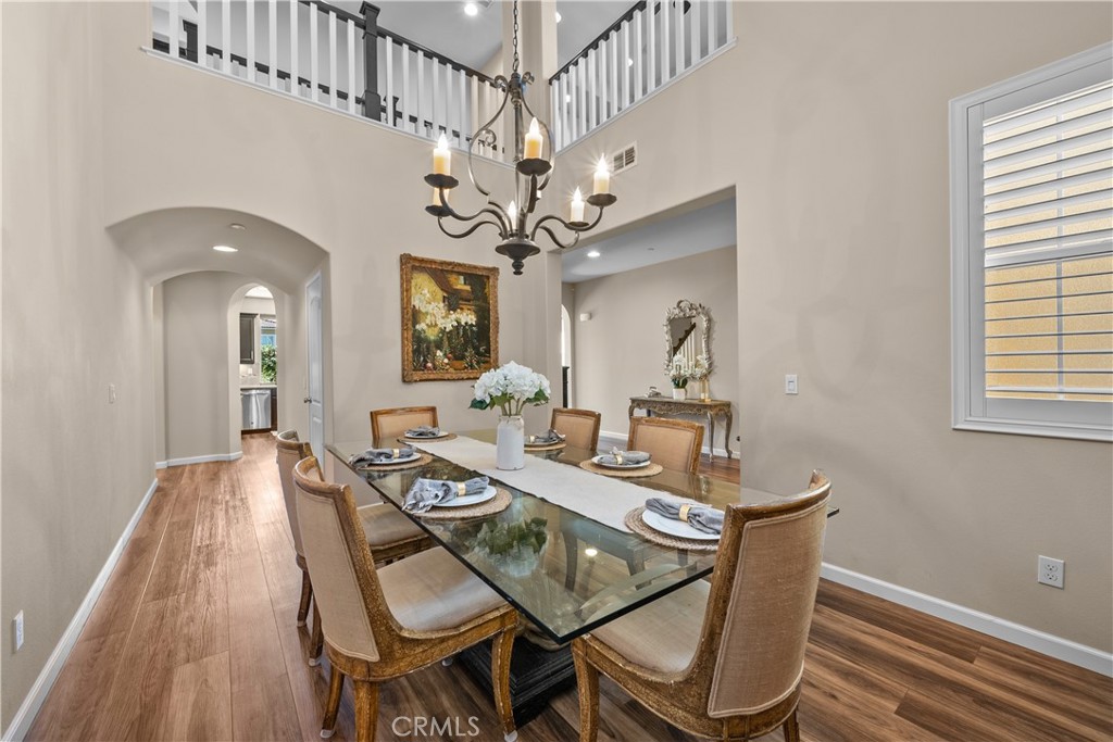 28640 Farrier Drive Valencia, CA 91354 - Photo 6 of 67 a view of a dining room with furniture and a chandelier