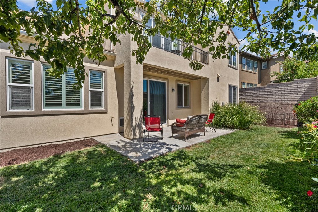 28640 Farrier Drive Valencia, CA 91354 - Photo 61 of 67 a view of a chair and table in backyard of the house