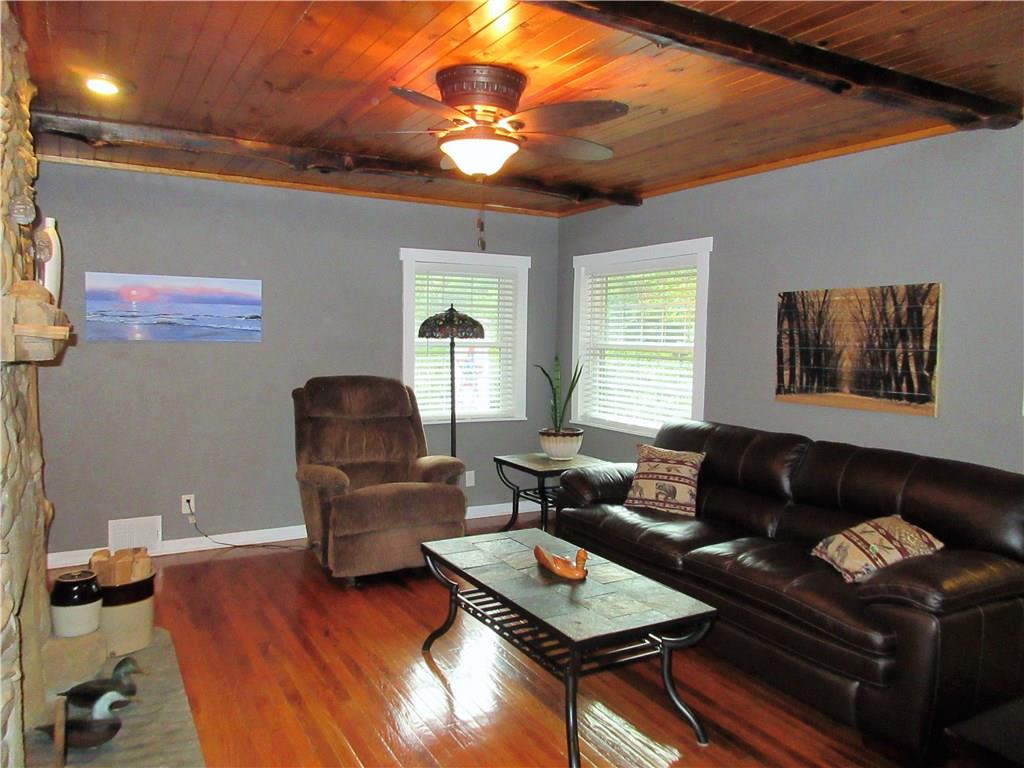 446 Baileys Run Road Tarentum, PA 15084 - Photo 3 of 25 Lots of natural light makes the natural wood work pop in this living room.