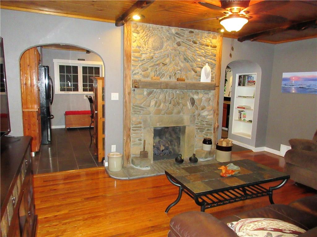 446 Baileys Run Road Tarentum, PA 15084 - Photo 5 of 25 Living room has a ceiling fan with light, and has 2 doorways leading into the kitchen.