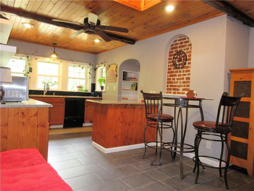 446 Baileys Run Road Tarentum, PA 15084 - Photo 6 of 25 Check out the character of this kitchen from the B board ceiling with honed Hemlock wood beams, ceramic floor, island, skylight, ceiling fan, window bench seat, and lots of windows to view the side yard.