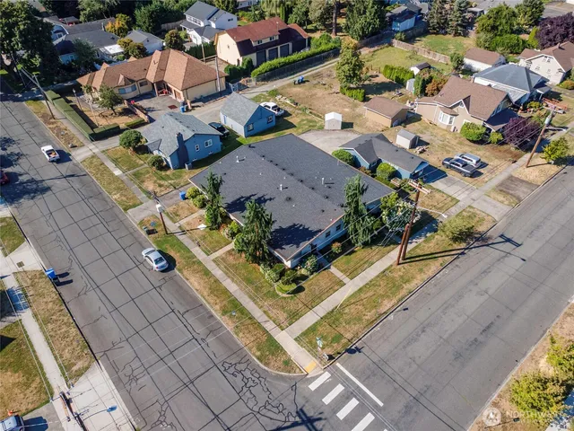 an aerial view of residential houses with outdoor space