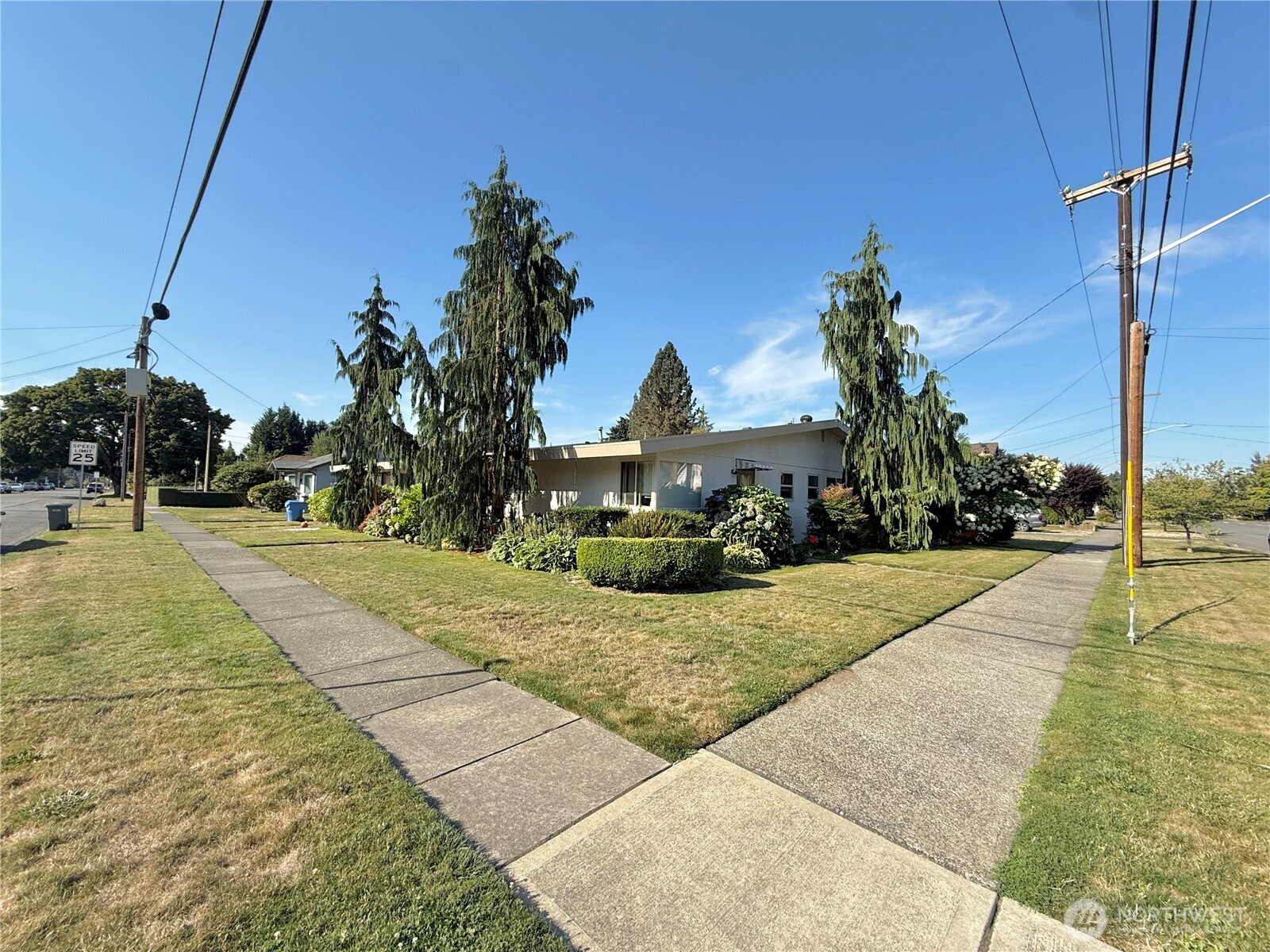 520 Sumner Avenue, Unit 524 Sumner, WA 98390 - Photo 2 of 20 a front view of a house with a yard