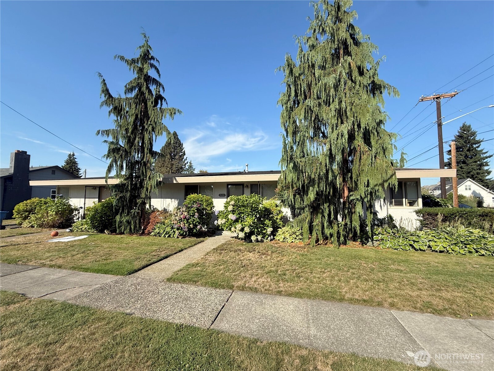 520 Sumner Avenue, Unit 524 Sumner, WA 98390 - Photo 4 of 20 a front view of a house with a yard