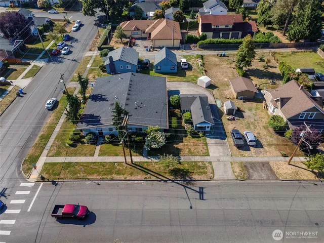 an aerial view of houses with yard