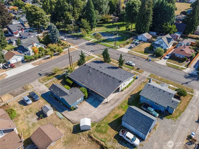 an aerial view of a house with a big yard