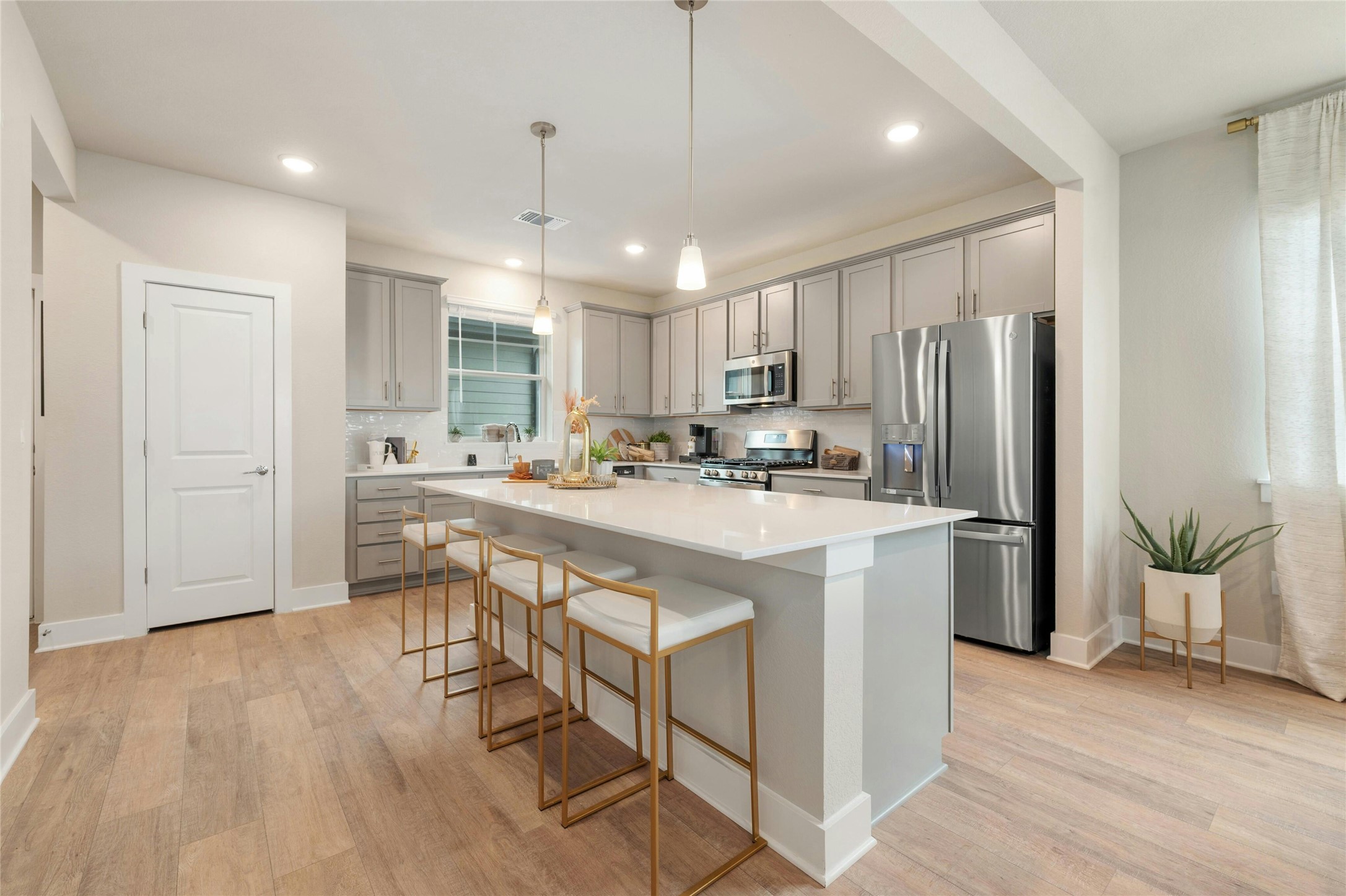 5804 Rotunda View Austin, TX 78747 - Photo 8 of 27 Gleaming stainless steel appliances and plentiful counter space outfit this modern, open-concept kitchen.