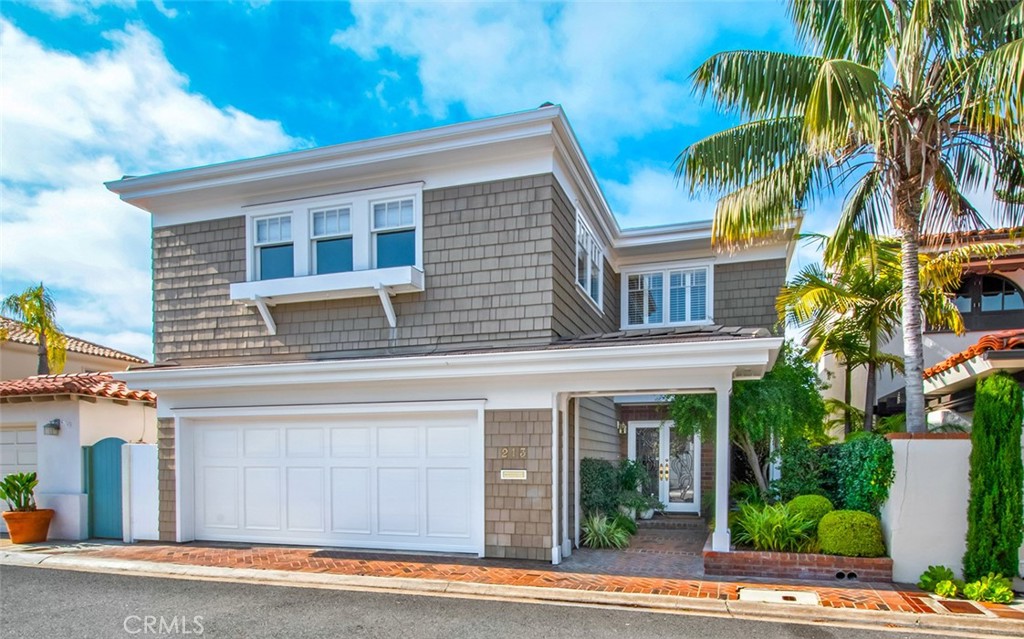 a view of a house with a yard and plants