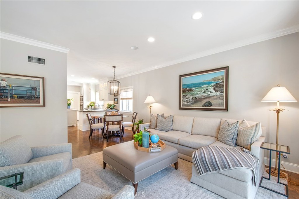 213 Via Firenze Newport Beach, CA 92663 - Photo 14 of 41 a living room with furniture and a chandelier
