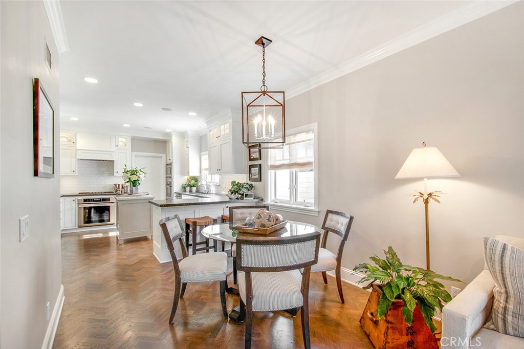 213 Via Firenze Newport Beach, CA 92663 - Photo 15 of 41 a view of a dining room with furniture window and wooden floor