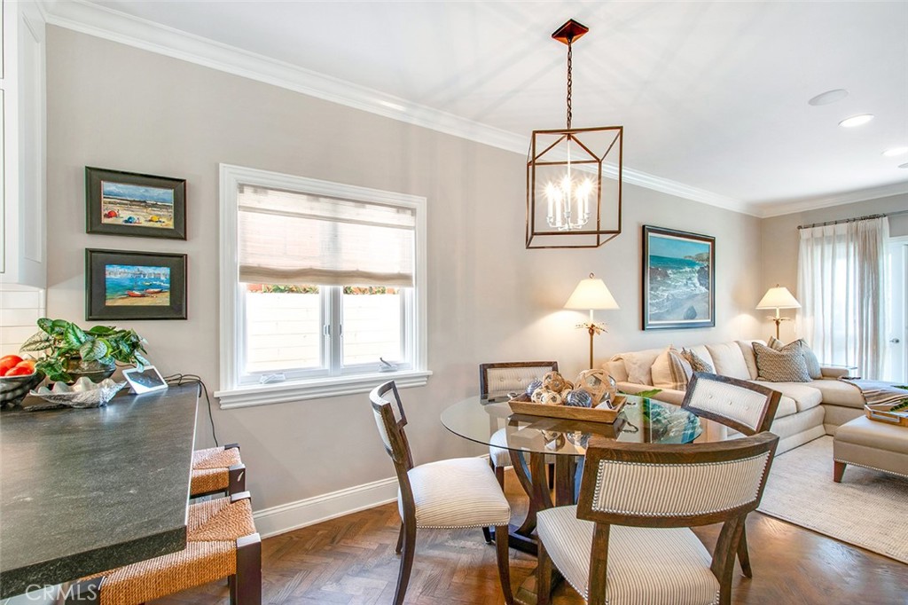 213 Via Firenze Newport Beach, CA 92663 - Photo 17 of 41 a dining room with furniture window and wooden floor