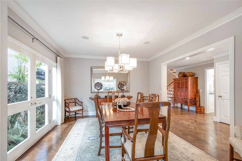 213 Via Firenze Newport Beach, CA 92663 - Photo 19 of 41 a view of a dining room with furniture window and wooden floor