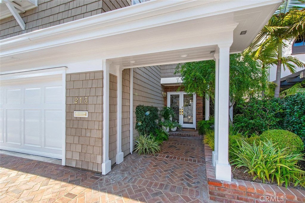 213 Via Firenze Newport Beach, CA 92663 - Photo 2 of 41 a view of house with backyard and garden