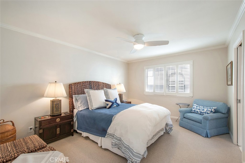 213 Via Firenze Newport Beach, CA 92663 - Photo 29 of 41 a bedroom with a bed and a couch