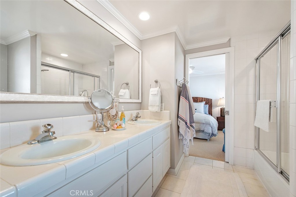 213 Via Firenze Newport Beach, CA 92663 - Photo 30 of 41 a en suite bathroom with double vanity sinks and a mirror