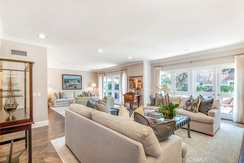 213 Via Firenze Newport Beach, CA 92663 - Photo 3 of 41 a living room with furniture and a large window