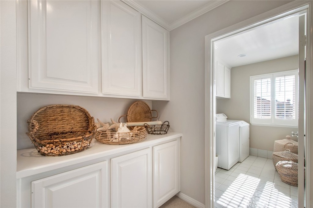 213 Via Firenze Newport Beach, CA 92663 - Photo 35 of 41 a kitchen with stainless steel appliances granite countertop a sink and cabinets