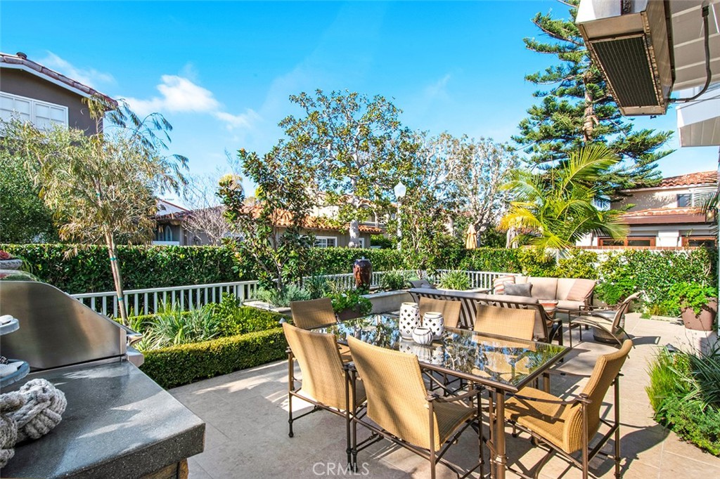 213 Via Firenze Newport Beach, CA 92663 - Photo 36 of 41 a view of a patio with couches chairs and a potted plant