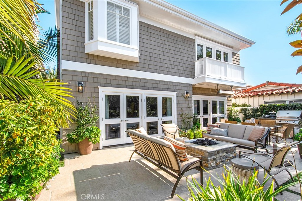 213 Via Firenze Newport Beach, CA 92663 - Photo 39 of 41 a view of a patio with couches table and chairs and potted plants