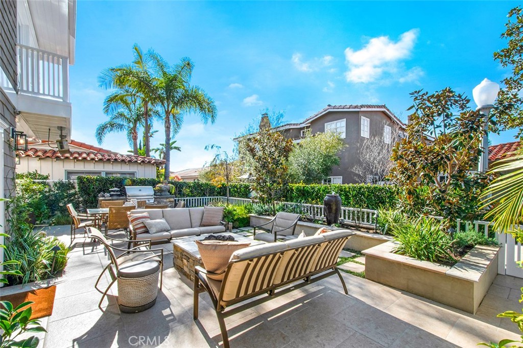 213 Via Firenze Newport Beach, CA 92663 - Photo 40 of 41 a view of a patio with couches and table and chairs and potted plants