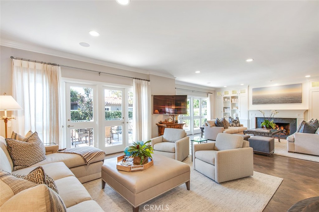 213 Via Firenze Newport Beach, CA 92663 - Photo 5 of 41 a living room with furniture and a large window
