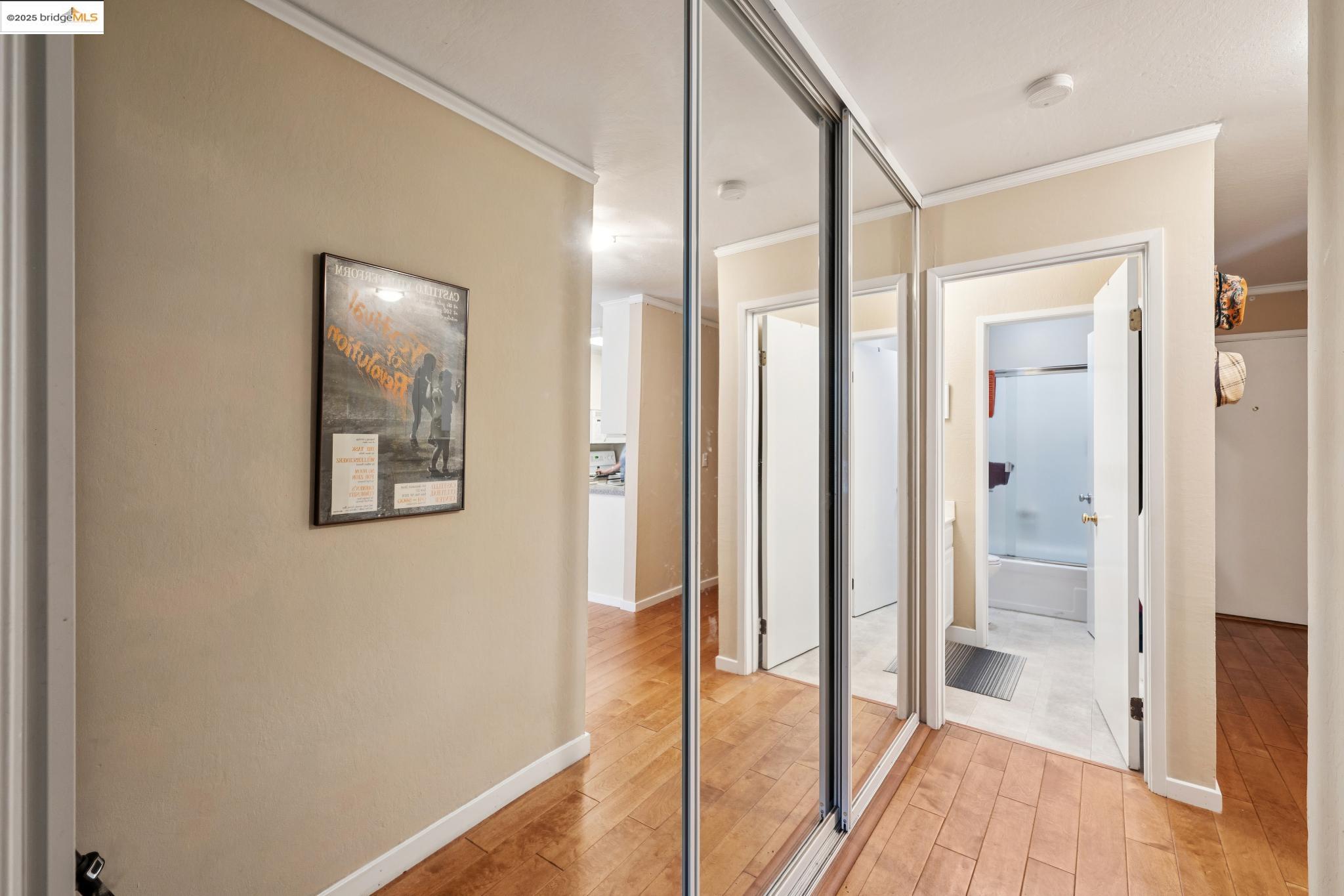 250 Whitmore Street Oakland, CA 94611 - Photo 25 of 33 Corridor featuring crown molding and light wood-style flooring