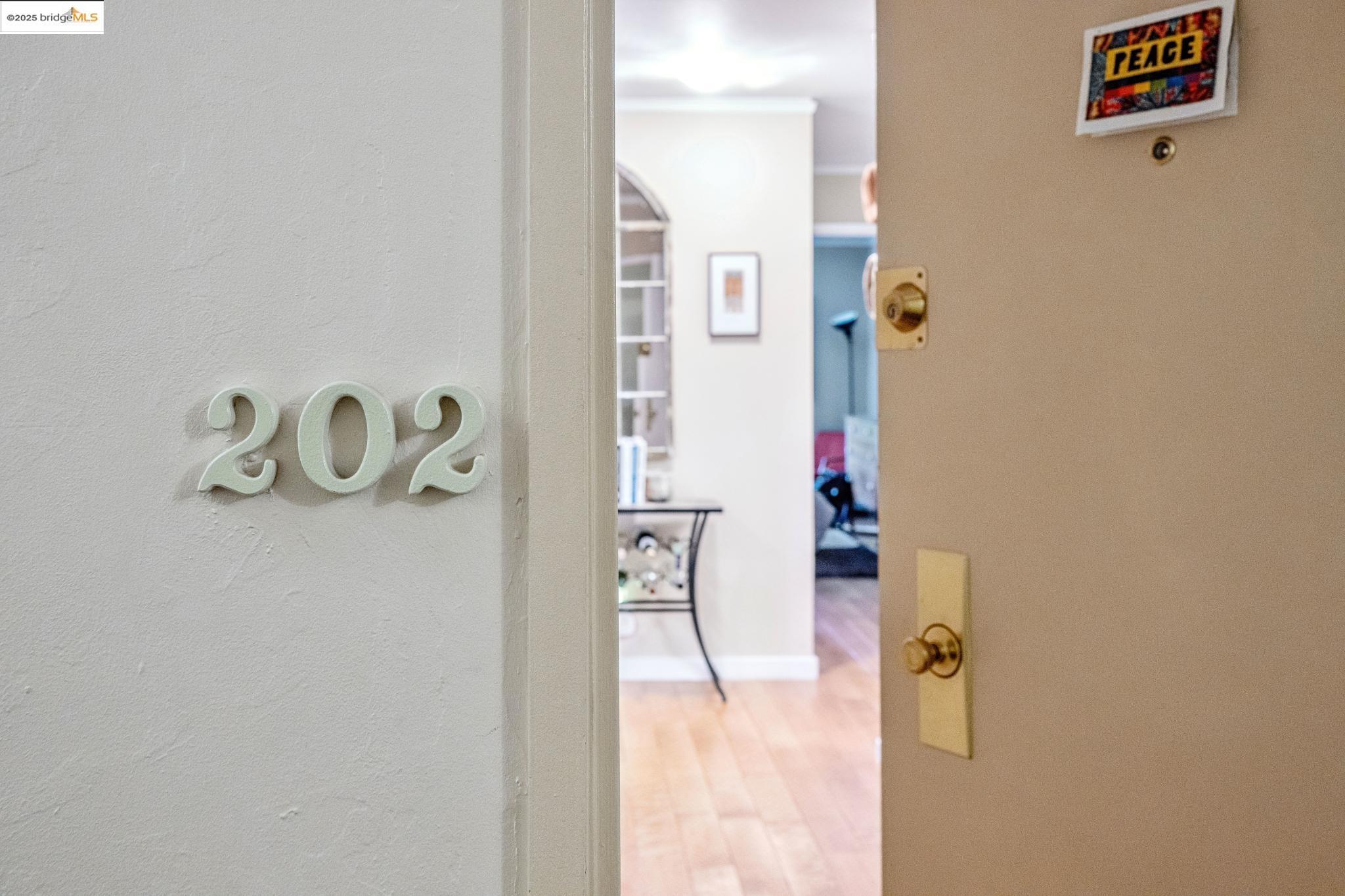 250 Whitmore Street Oakland, CA 94611 - Photo 3 of 33 Hallway with wood finished floors and baseboards