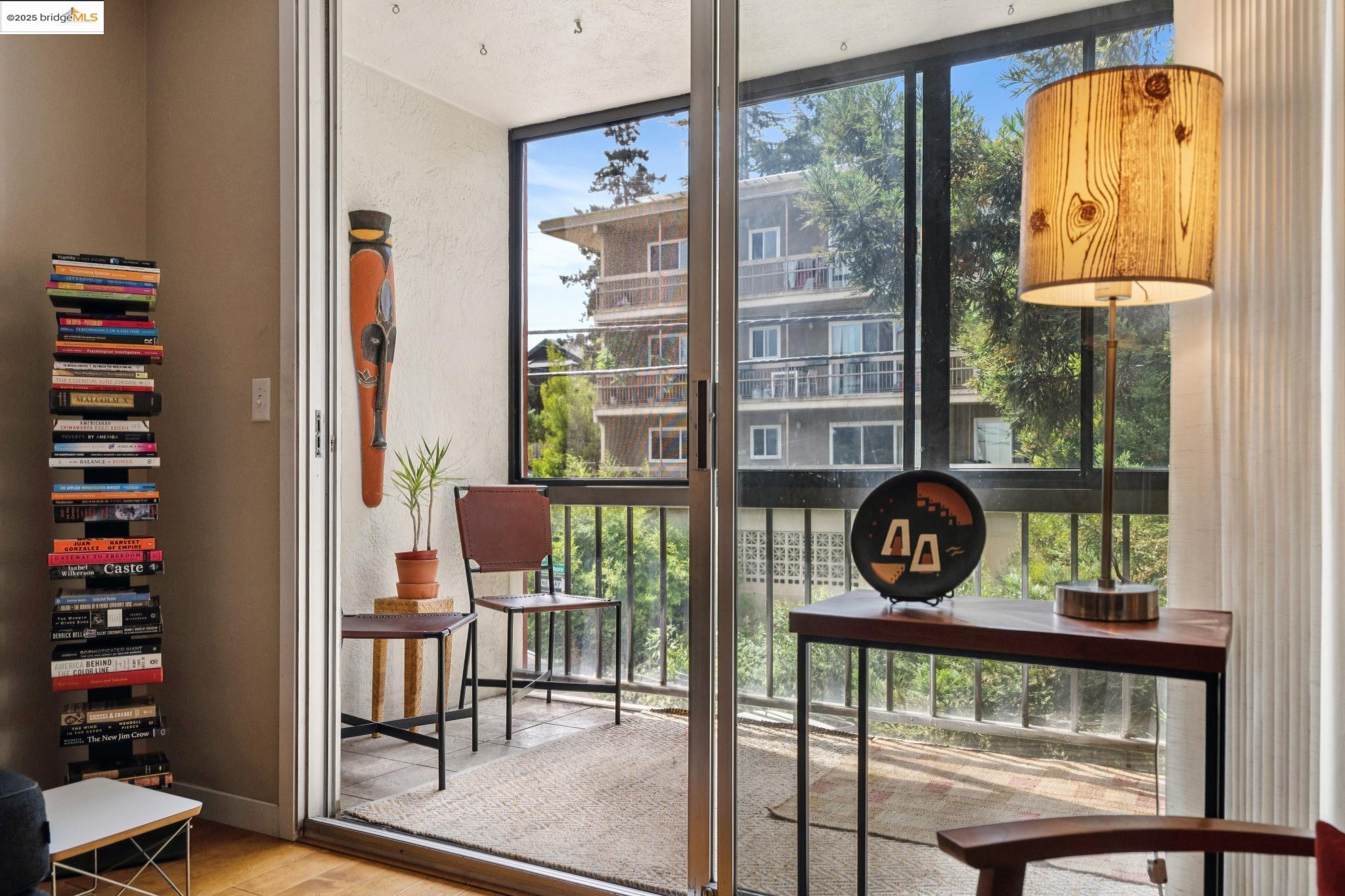250 Whitmore Street Oakland, CA 94611 - Photo 10 of 33 Entryway with expansive windows and wood finished floors