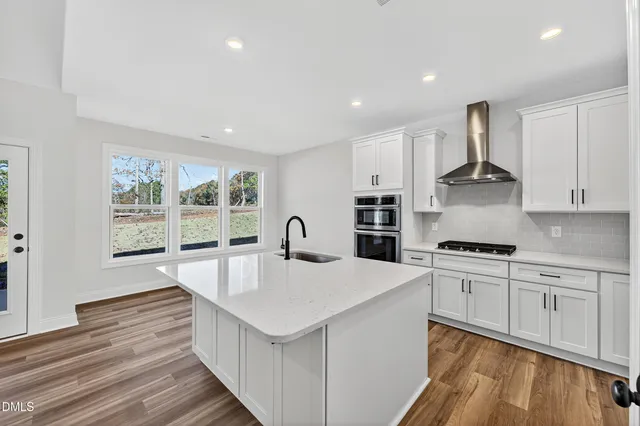 a bathroom with a double vanity sink a mirror and a shower