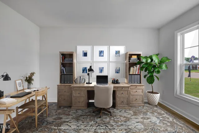 a hallway with a white walls and wooden floor